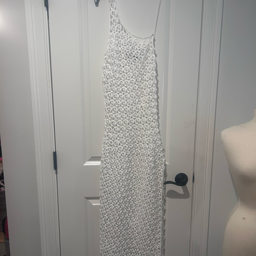 Elegant one shoulder crochet with pearl with slide slit .